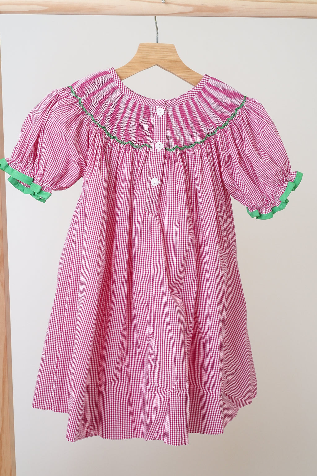 Pink christmas joy hand smocked gingham dress