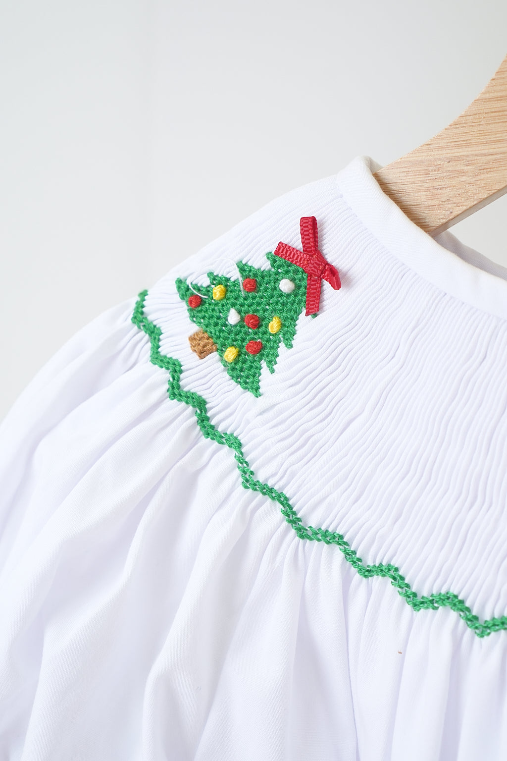 White Christmas tree hand smocked girl romper